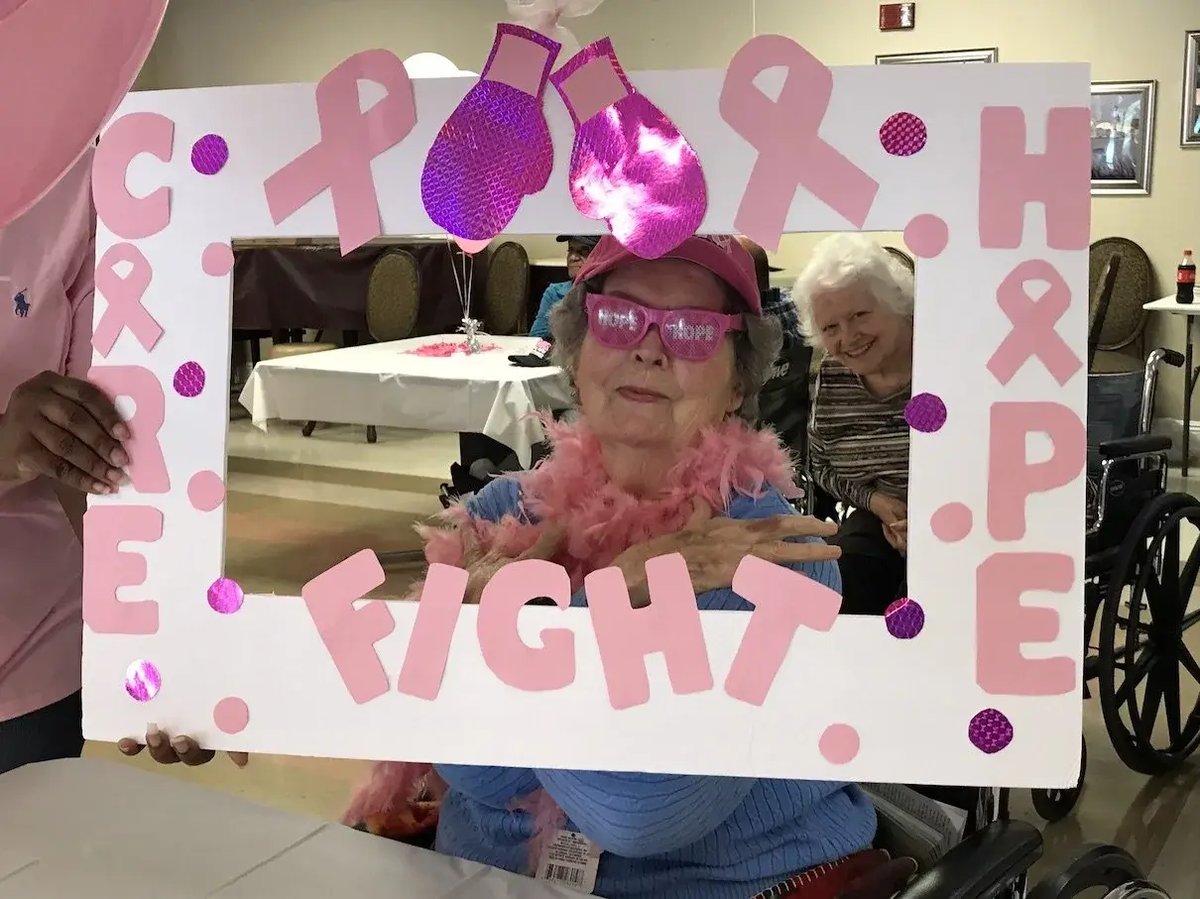 Elderly Woman Holding Sign